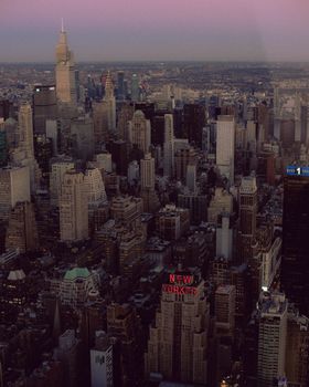 A breathtaking aerial view of New York City's skyline at dusk with vibrant urban architecture.