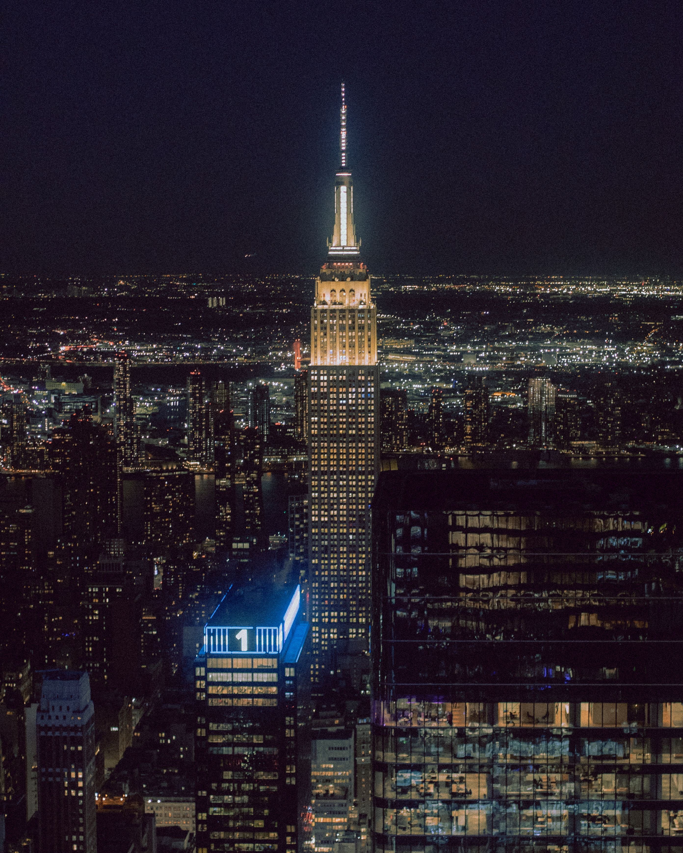 The Empire State Building and Skyline of New York City at Night · Free ...