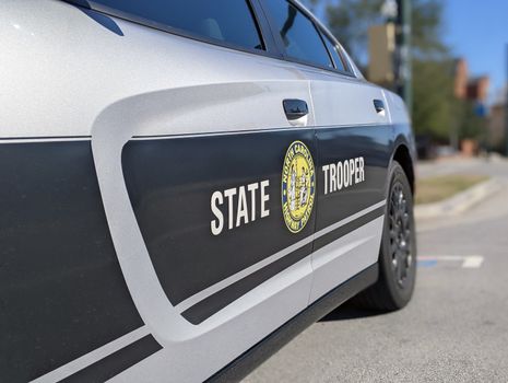 A patrol car representing the Michigan State Police budget and public safety spending.