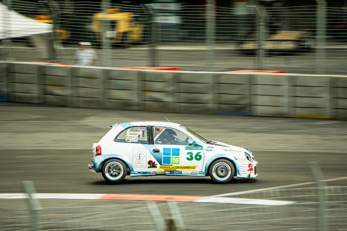 Car Racing on a Track · Free Stock Photo