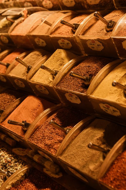 Free A vibrant display of diverse spices at a market, showcasing rich colors and textures. Stock Photo