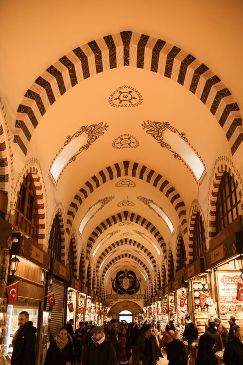 Free Explore the vibrant atmosphere inside Istanbul's famous Egyptian Bazaar with shoppers crowding the stunning architectural space. Stock Photo