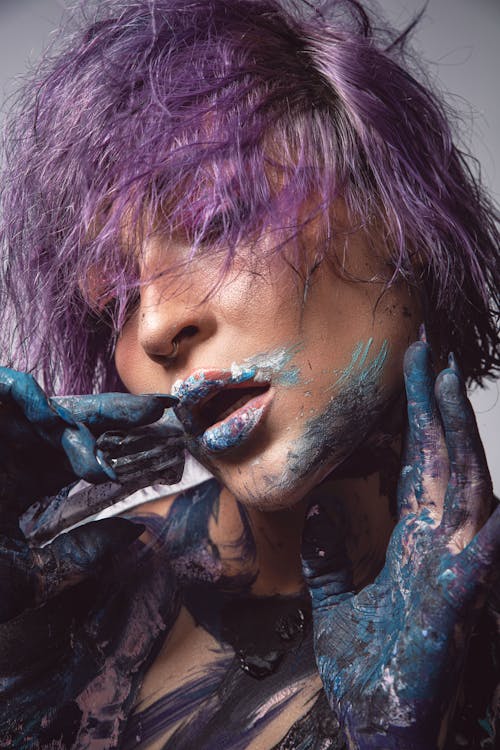 Purple Hair Model with Paint on Hands