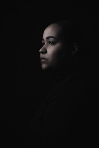 Low-key portrait in shadow, photo by Elisanette Ortiz on Pexels
