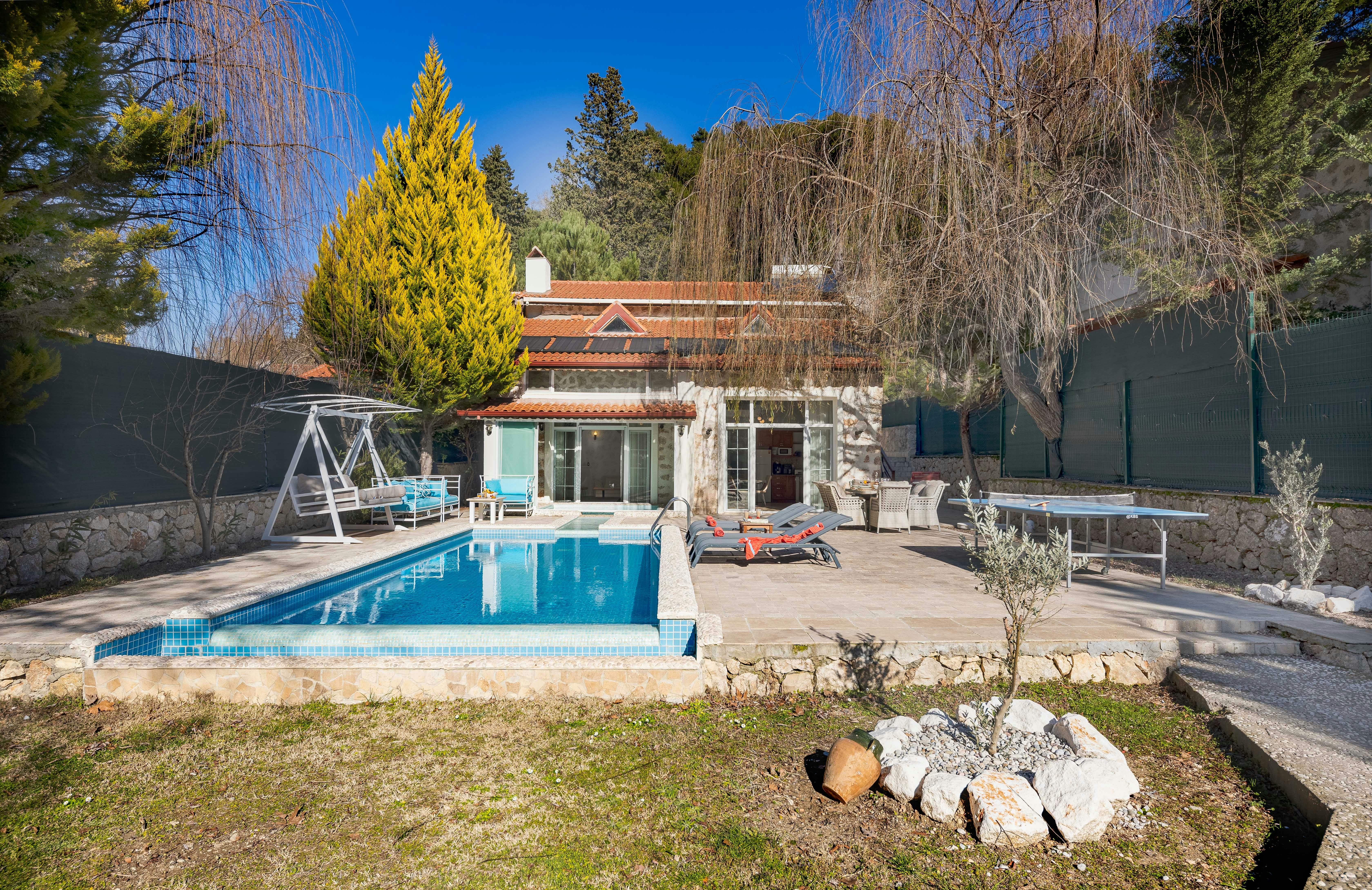 pool surrounded by artificial turf - turf backyard