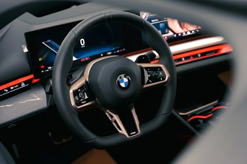 The interior of a bmw car with a steering wheel