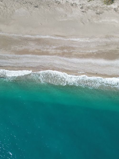 Free Breathtaking aerial photo of Antalya's turquoise shoreline, ideal for travel and nature themes. Stock Photo