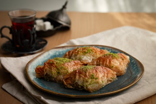 A plate of pastries with tea on it