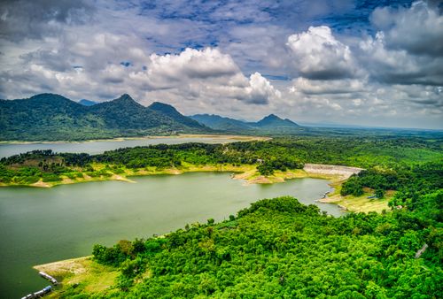 Free Breathtaking aerial view of lush green landscape with a lake and mountains in Indonesia. Stock Photo