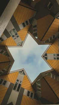 View of Cube Houses in Rotterdam creating a star shape against the sky.