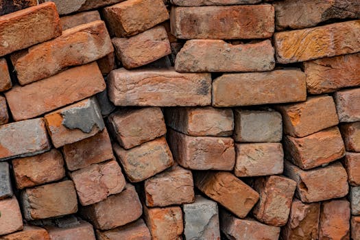Close-up of uneven stacked bricks showing texture and color variations.