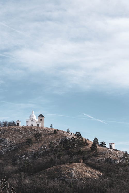 A church on a hill with a blue sky