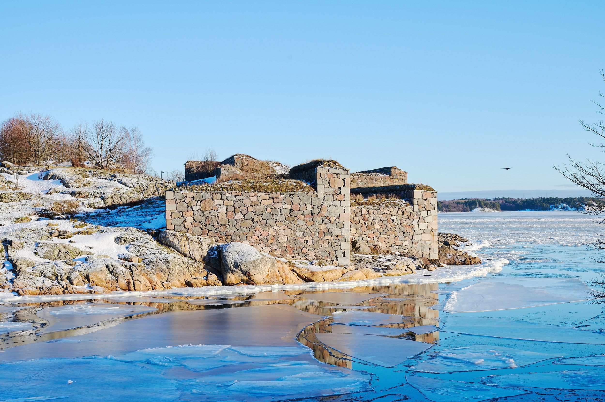 Scenic winter view of Suomenlinna fortress with icy landscape in Helsinki, Finland. - Helsinki