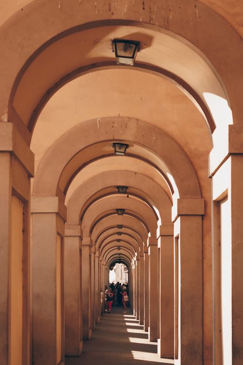 Free Elegant arched corridor in Florence, Italy, showcasing classic architecture. Stock Photo