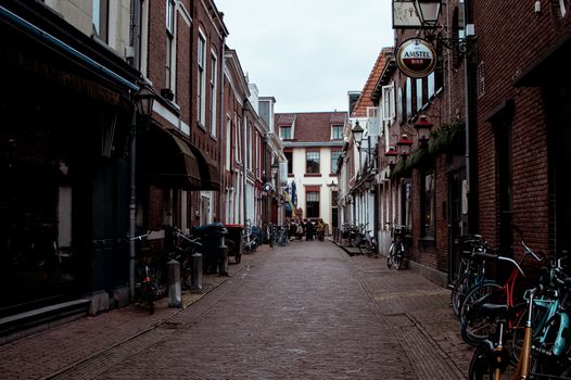 Picturesque street in Leeuwarden, Netherlands with bicycles and historic architecture., free online jigsaw puzzle on JigsawPuzzlesFreeOnline.org