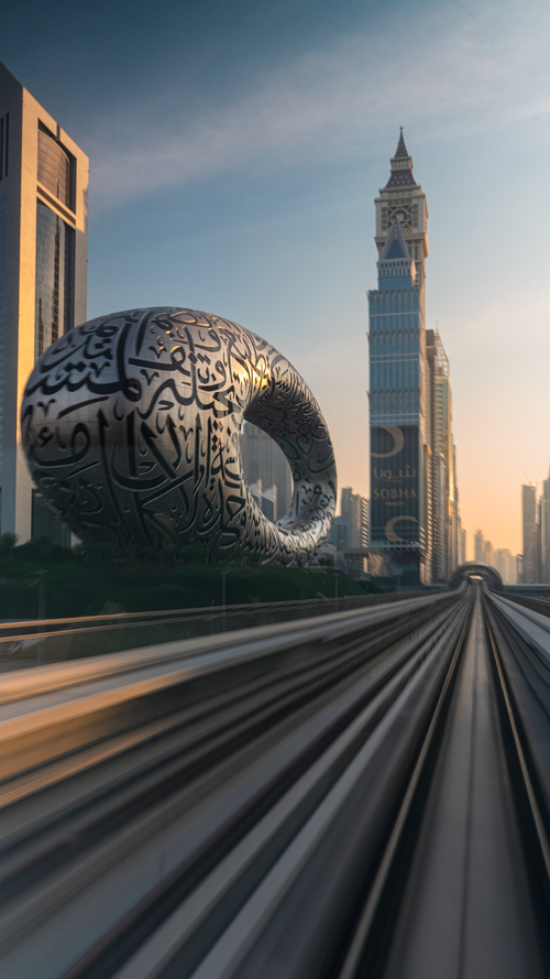 Free The Museum of the Future and Dubai's skyline captured beautifully at sunset in an urban setting. Stock Photo