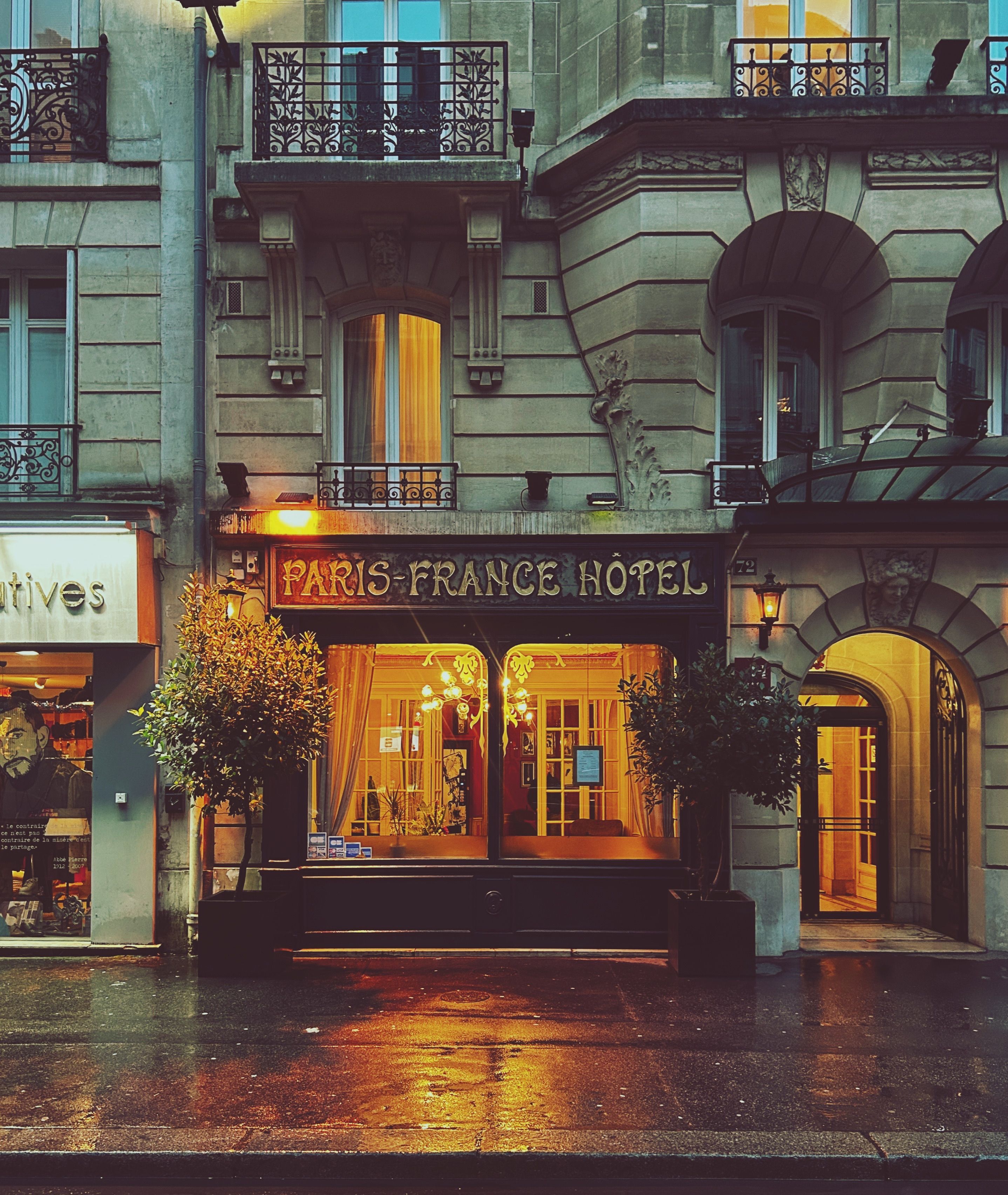 Atmospheric night view of a Paris hotel, highlighting classic architecture and city charm.