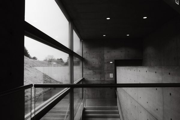 Stairwell in board-marked concrete — photo by Laura Cleffmann on Pexels