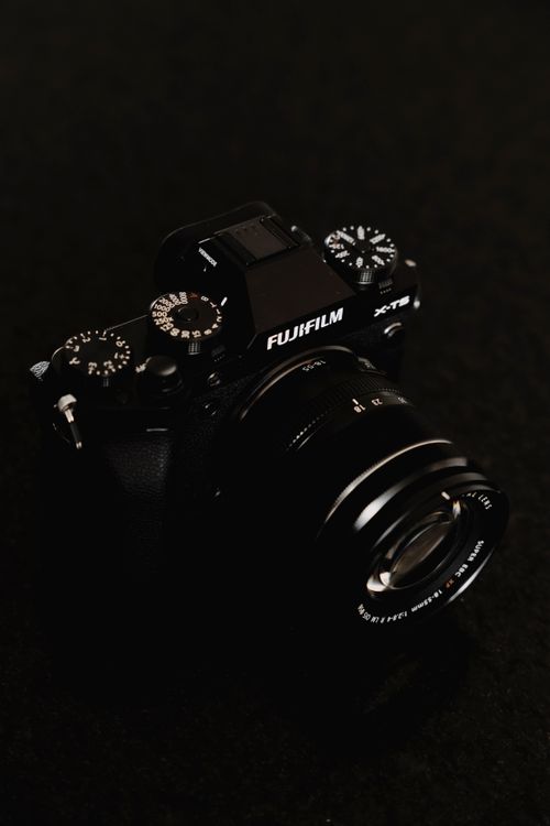 Free Close-up of a Fujifilm mirrorless camera model X-T2 on a dark background. Stock Photo