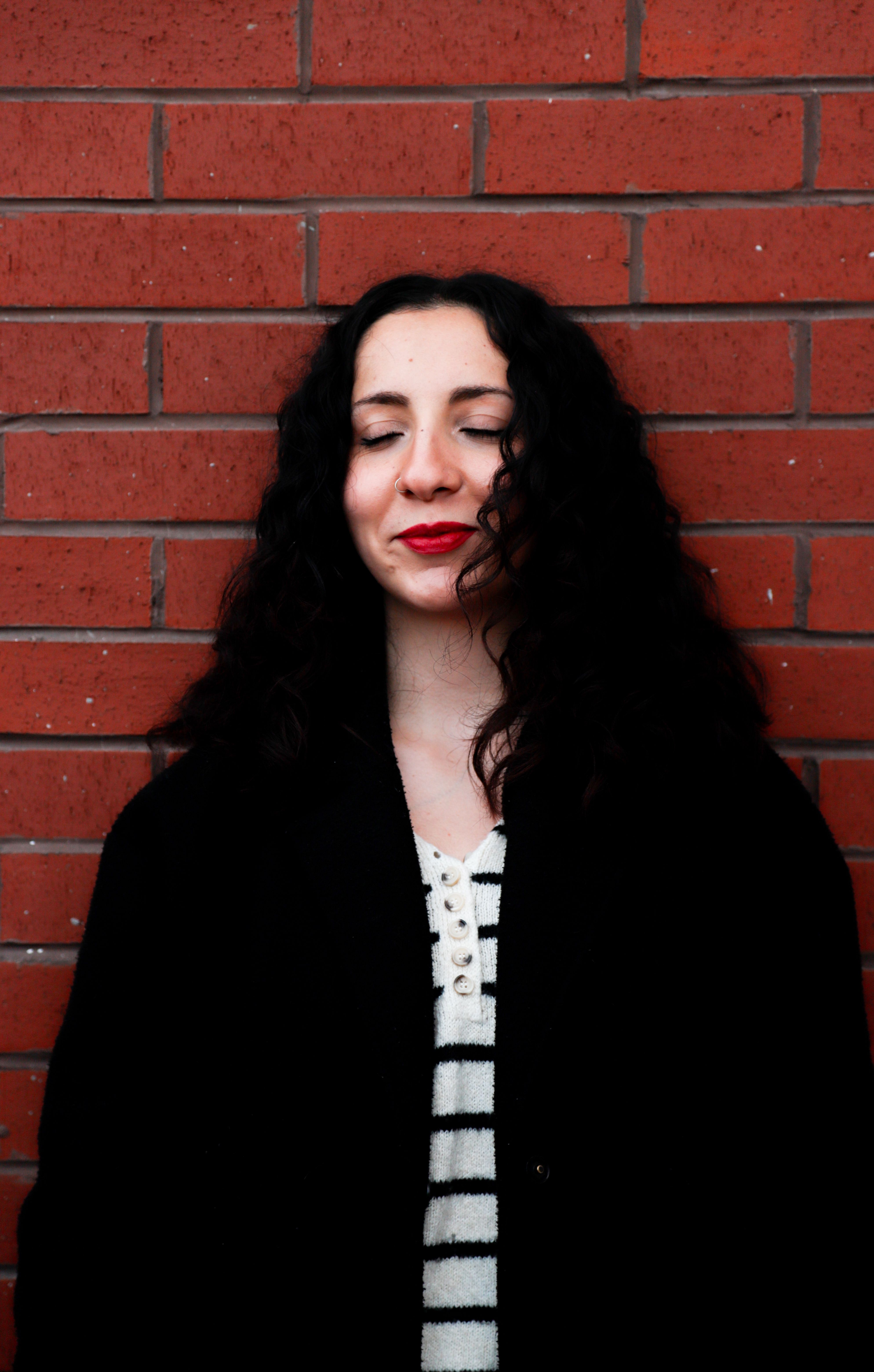 Portrait of Smiling Woman with Black Hair · Free Stock Photo