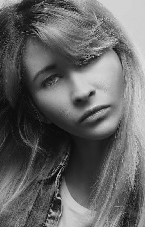 A black and white photo of a woman with long hair