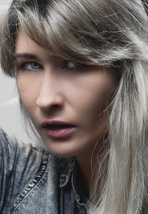 Close-up Studio Portrait of a Young Woman with Gray Hair 