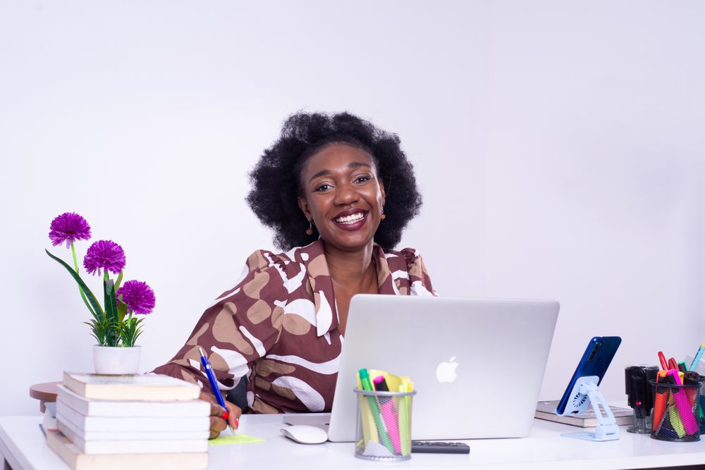 African businesswoman managing assets in an office in Kinshasa