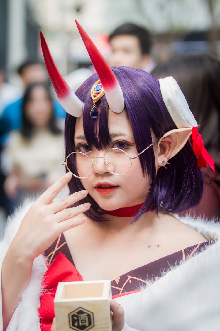 Close-Up Photo Of Woman With Horns