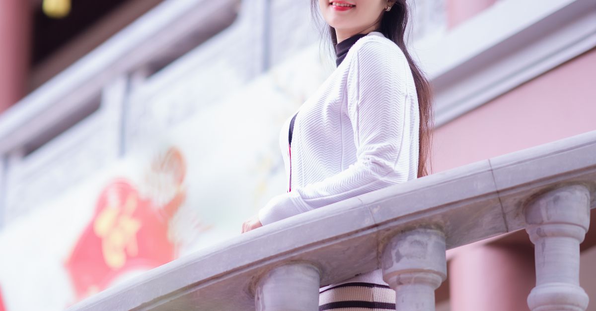 People Standing Behind Railing Smiling Woman Standing behind Railing · Free Stock Photo