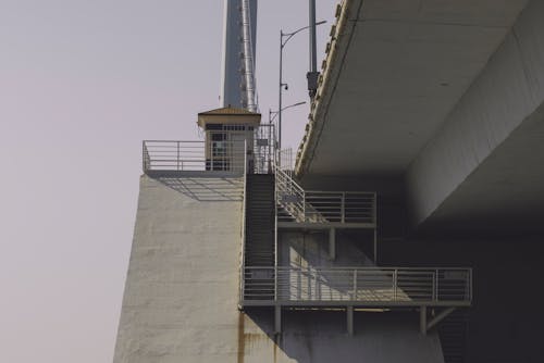 A bridge with stairs and a railing on it