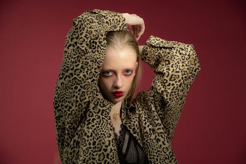 Studio Shot of a Young Woman Wearing a Red Lipstick 