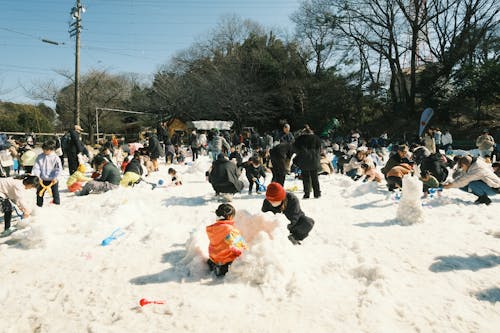 People and Children Playing in Snow