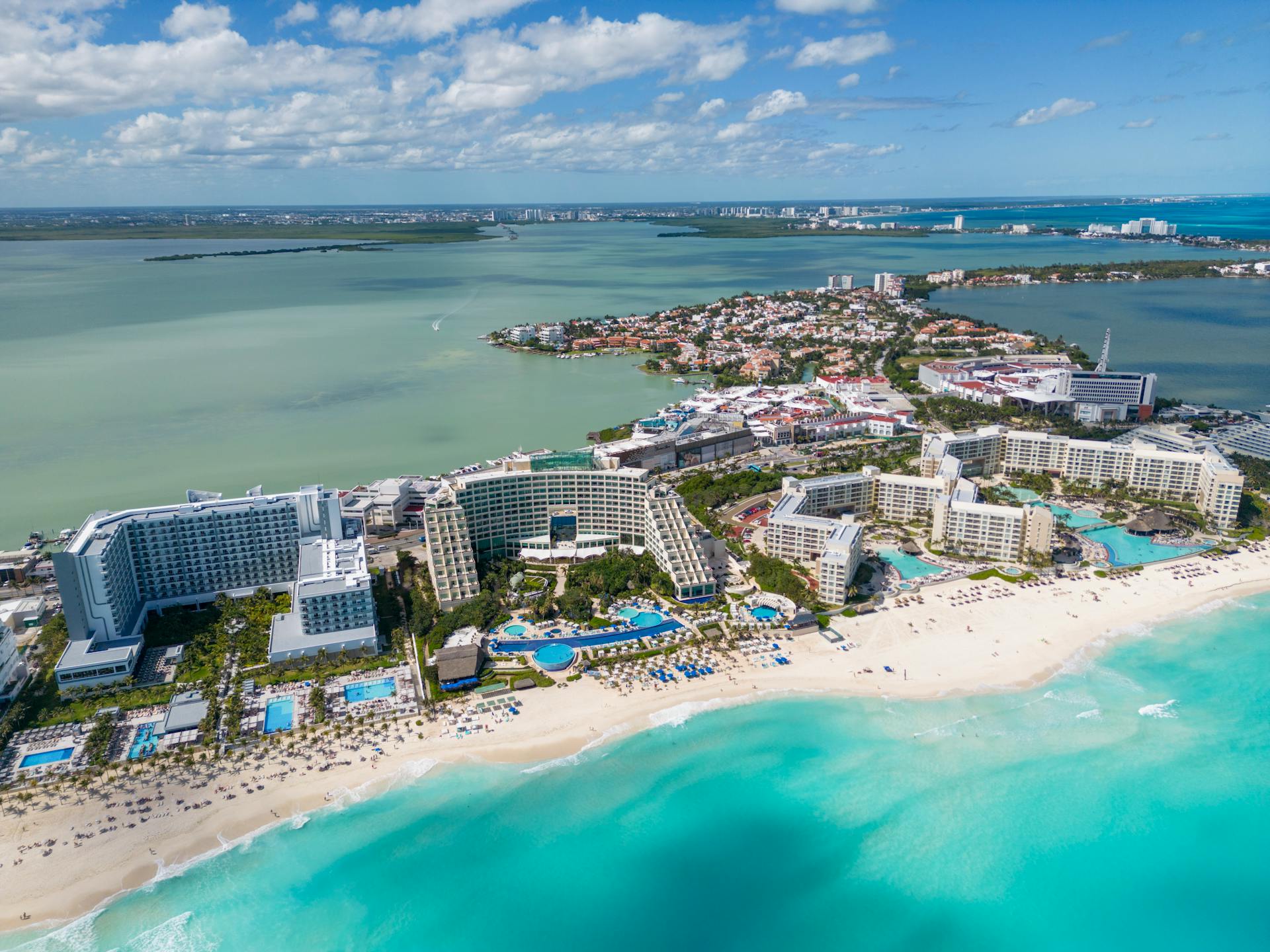 A stunning aerial view of Cancun's resorts and turquoise sea, ideal for vacation and travel scenes.