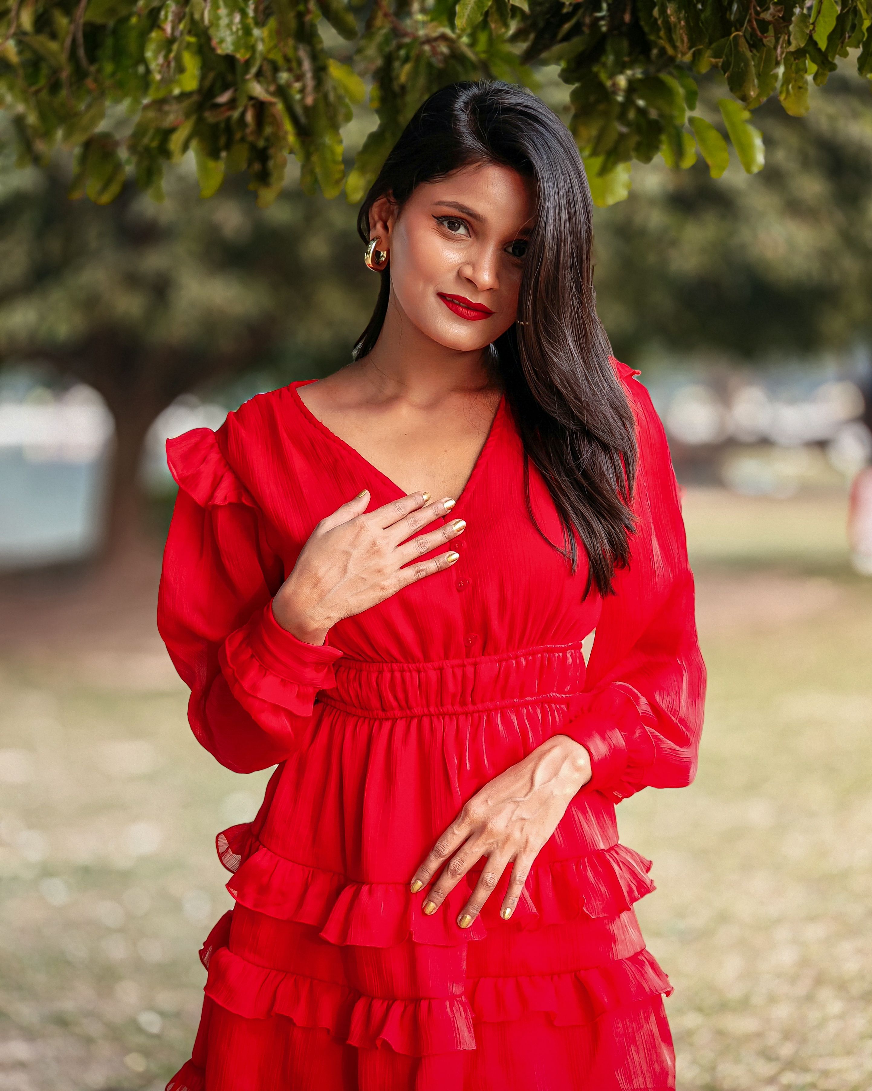 Portrait of Woman Standing in Red Dress · Free Stock Photo