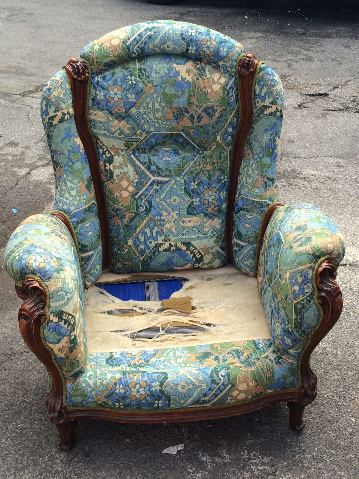 Vintage armchair with worn upholstery