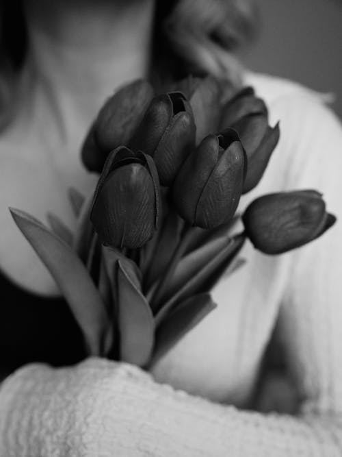 Woman Holding Bouquet of Tulips