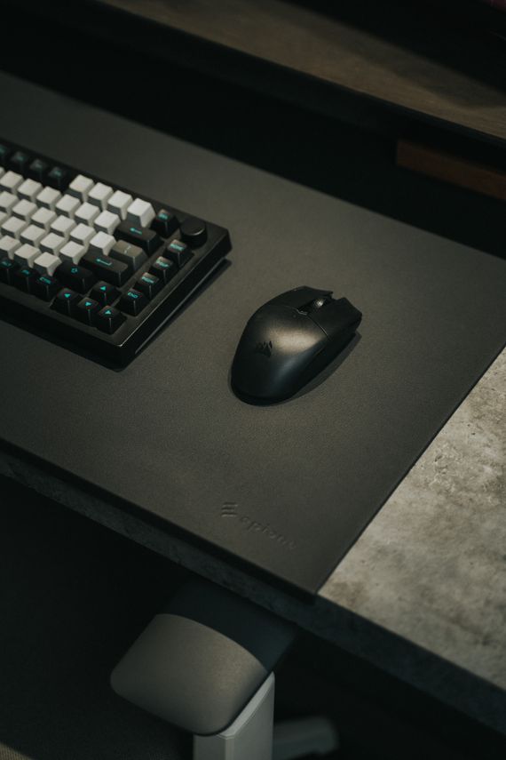 Real gaming keyboard and mouse arranged on a modern gaming desk