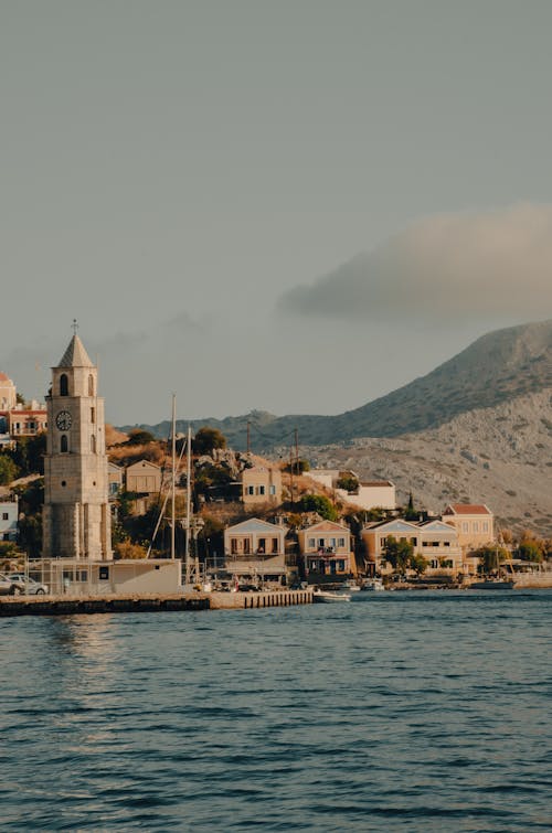 A boat with a church on it and mountains in the background