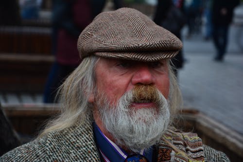 A man with a long white beard and a hat