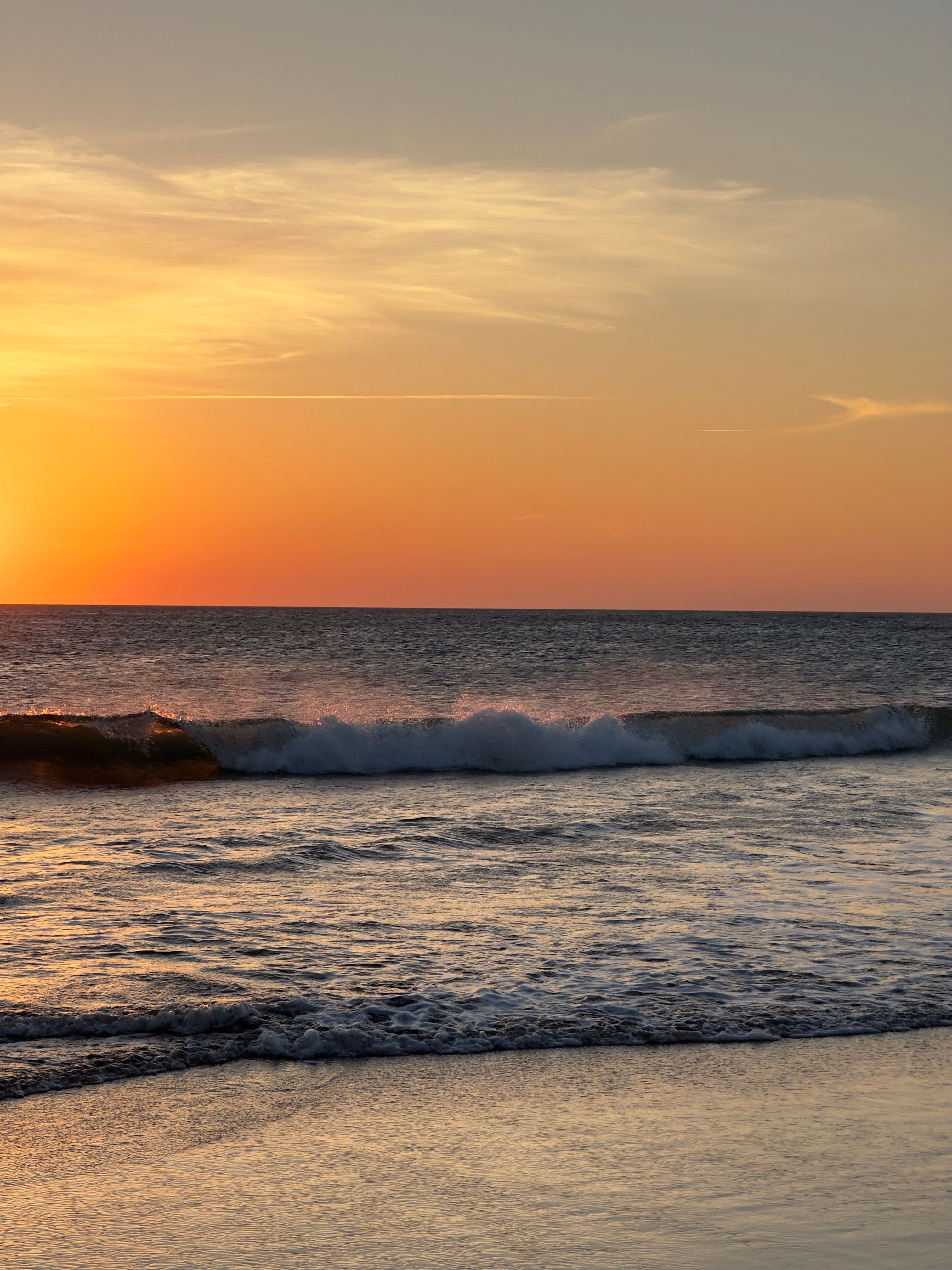 Waves Washing Up the Beach at Sunset · Free Stock Photo