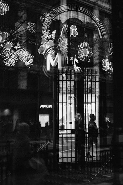 Subway Sign Mirroring in Window at Night 