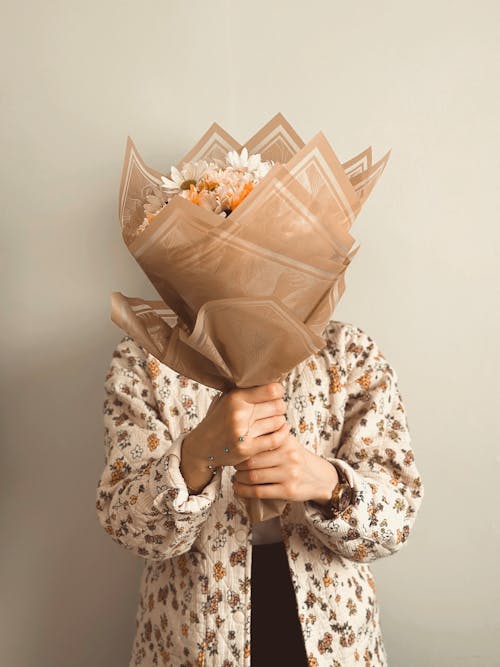 A person holding a bouquet of flowers
