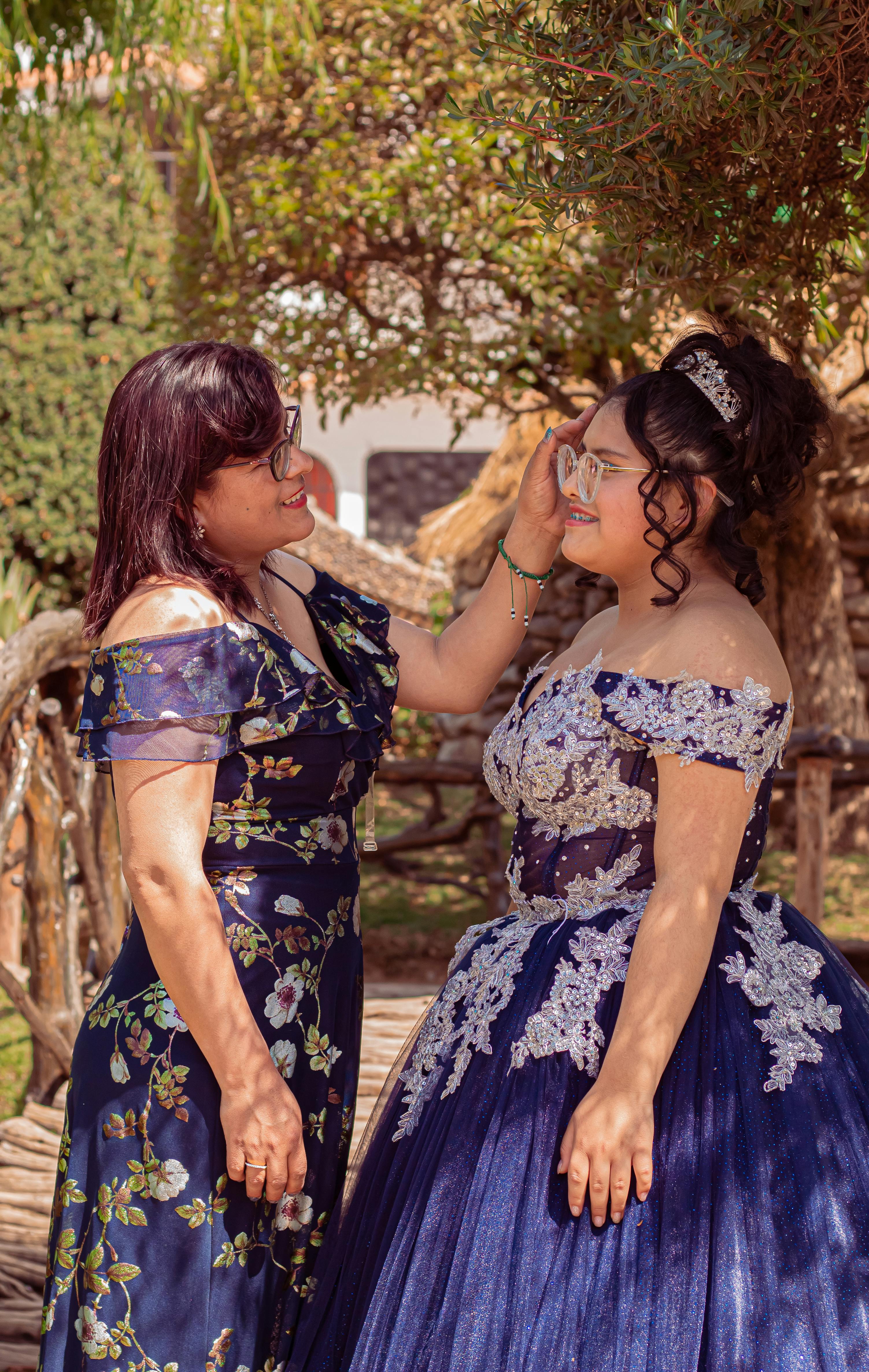 Mother with Daughter in Quinceanera Dress Free Stock Photo