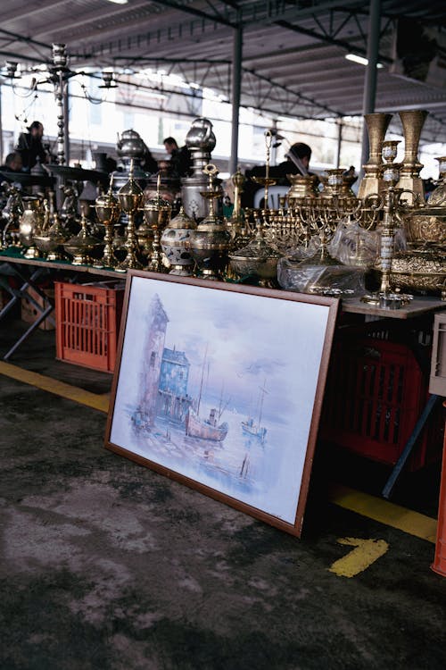 A Painting a Pottery Standing on a Market Stall 