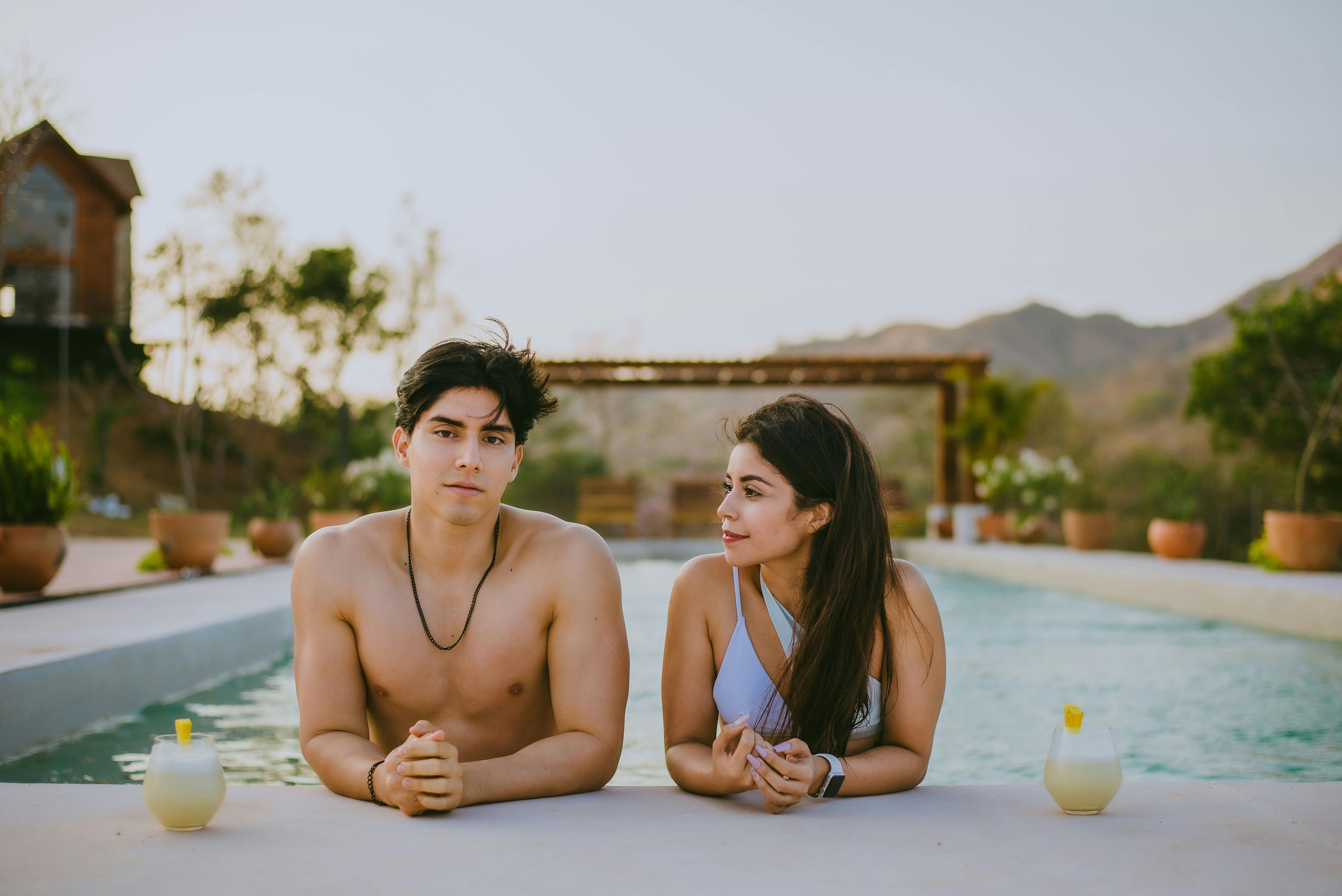 Happy Young Couple Practicing Yoga, Sitting In Lotus Pose Close By Swimming  Pool Stock Photo, Picture and Royalty Free Image. Image 33289684.