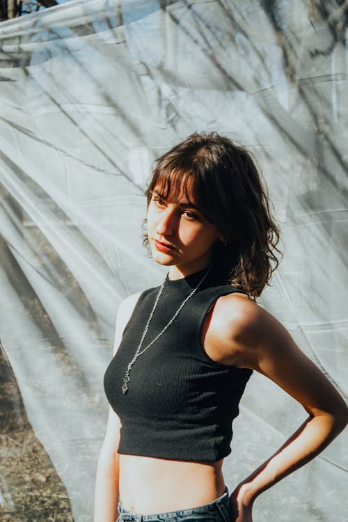 A woman in a black top and jeans