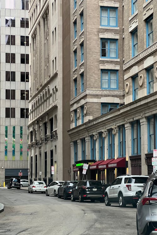 Cars Parked Along Avenue in City Downtown
