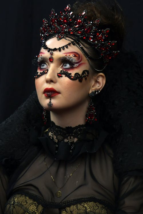 A woman with a gothic makeup and red lipstick