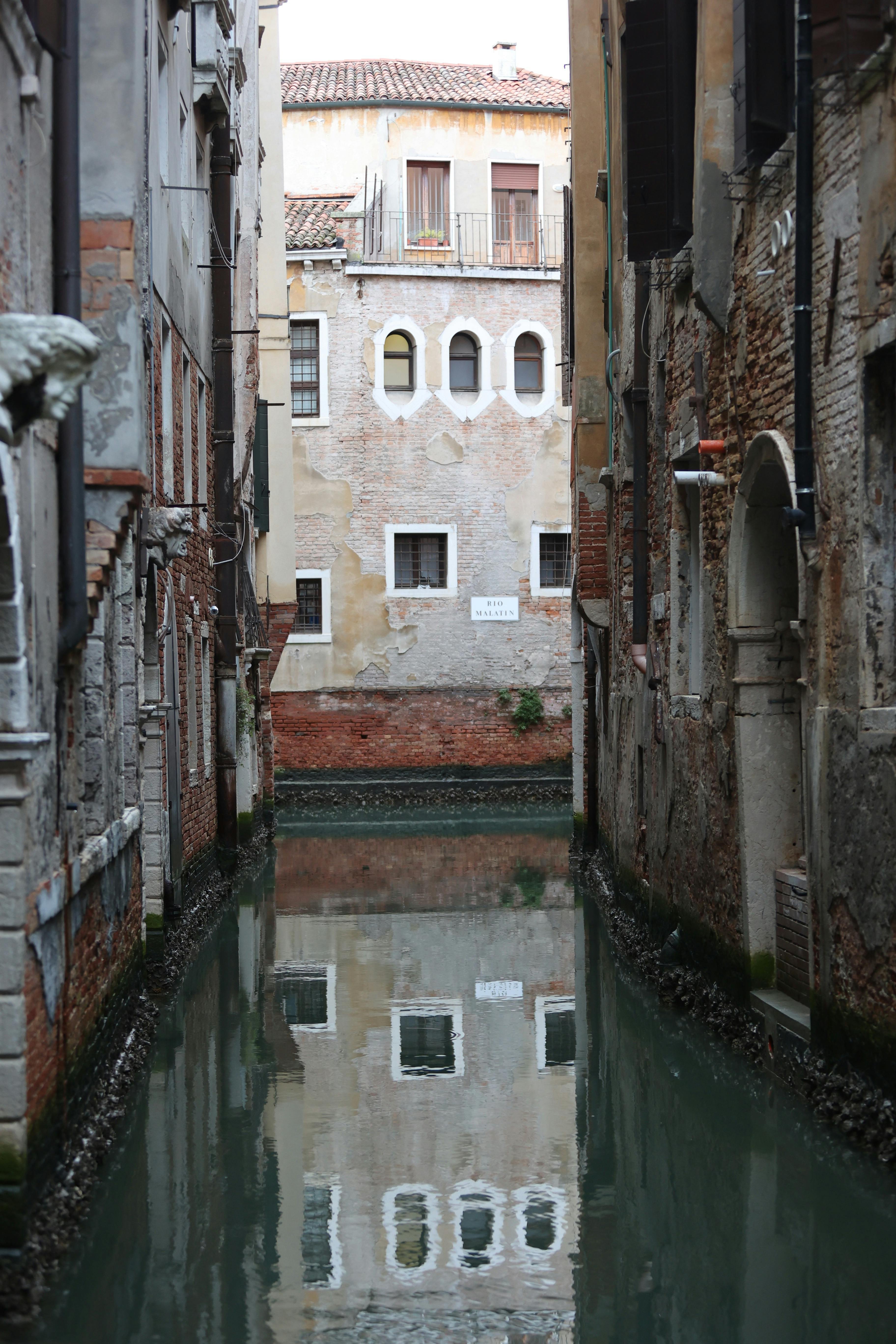 Buildings Reflecting in Canal