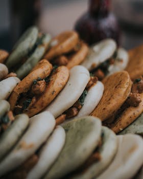 A close-up of mouthwatering Mediterranean falafel sandwiches stacked together with vibrant colors.